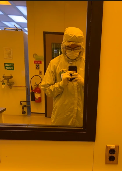 Bao Vo in cleanroom attire during undergraduate semiconductor research.